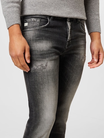 Goldgarn Skinny Jeans i grå