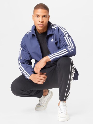 ADIDAS ORIGINALSMajica 'Reveal Essentials' - crna boja