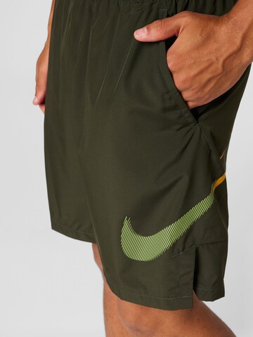 NIKE Loose fit Workout Pants in Green