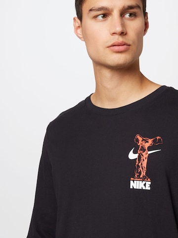 NIKE - Camiseta funcional en negro