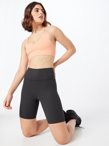 Skinny Pantaloni sportivi di Girlfriend Collective in nero