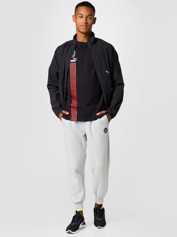 PUMA Tapered Housut värissä harmaa