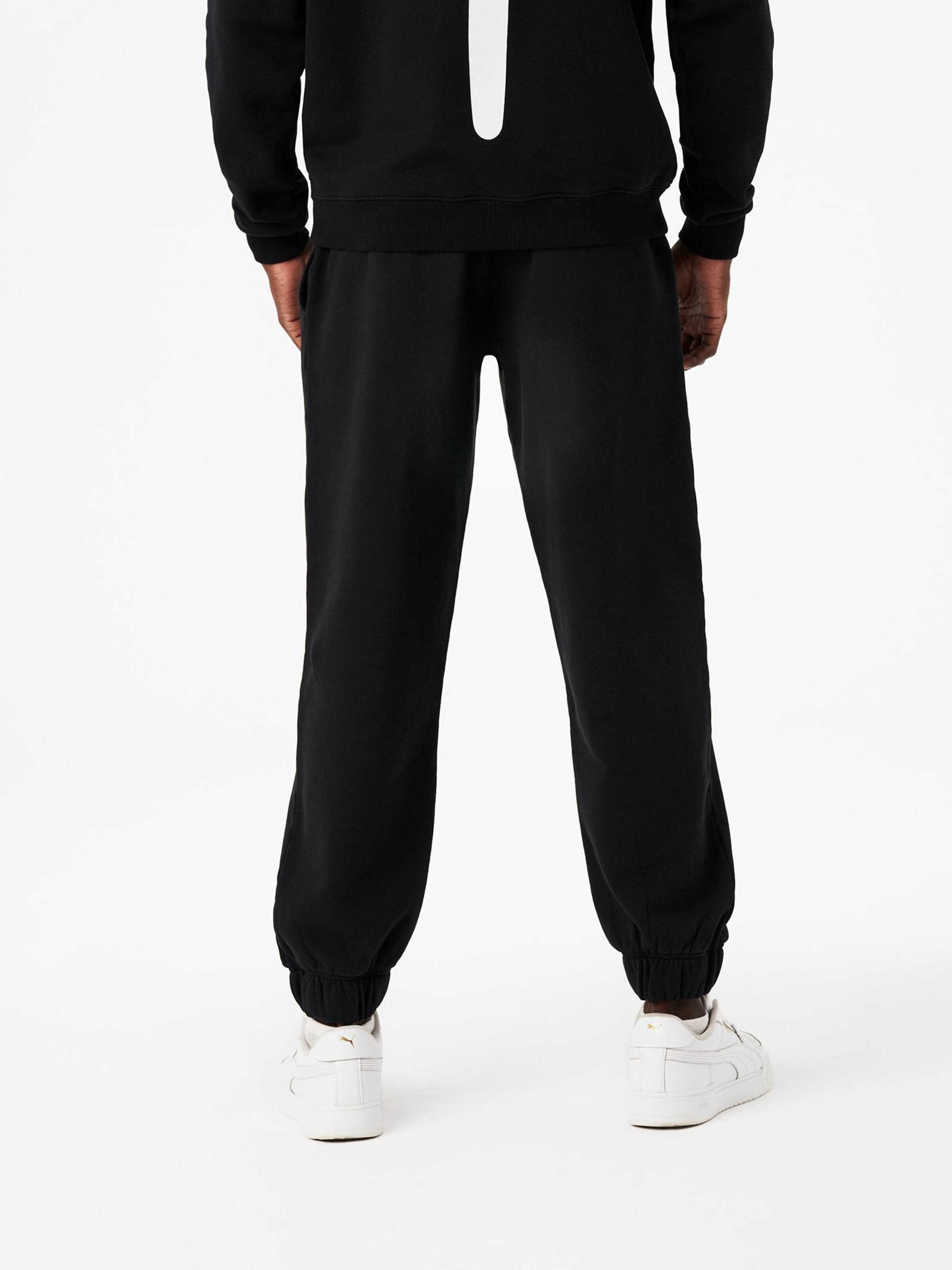 Carnales - Loosefit Pantalón 'Pantalón de chándal con logo bordado' en negro