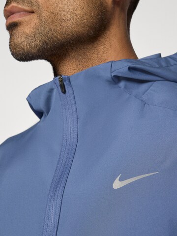 NIKE Trainingsjack 'Form' in Blauw