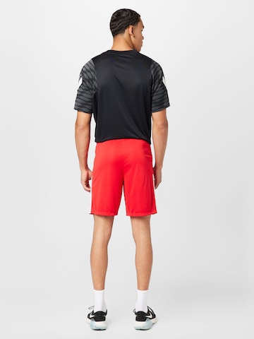 NIKE - regular Pantalón deportivo en rojo