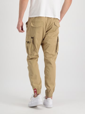 ALPHA INDUSTRIES - Tapered Calças cargo 'Airman' em bege