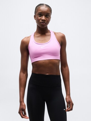 NIKE Bustier Biustonosz sportowy 'SWSH' w kolorze różowy: przód
