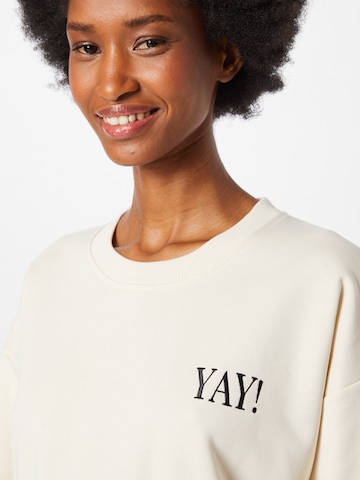 #NANDINI x NovaLanaLove Sweatshirt 'YAY' in Beige