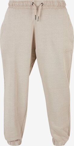 Tapered Pantaloni di Karl Kani in beige: frontale