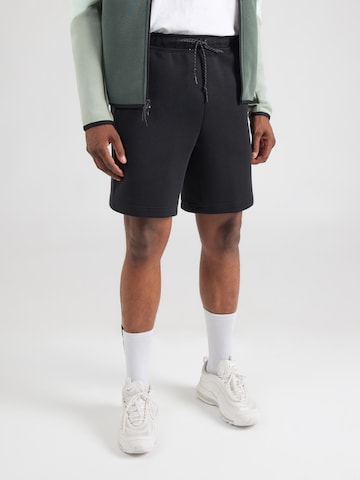 Nike Sportswear Ohlapna forma Hlače 'TECH FLC' | črna barva: sprednja stran