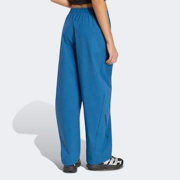 ADIDAS SPORTSWEAR - Pierna ancha Pantalón deportivo 'Z.N.E.' en azul