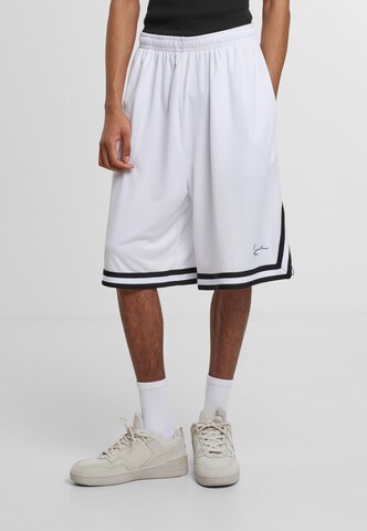 Karl Kani Loose fit Pants 'Signature' in Mixed colors: front