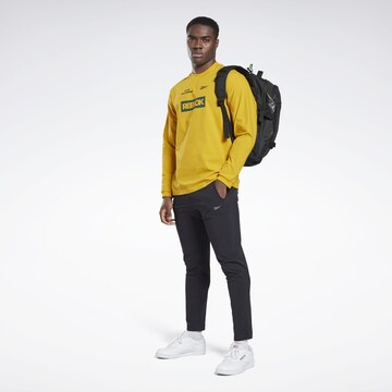 Reebok - Camiseta funcional en amarillo