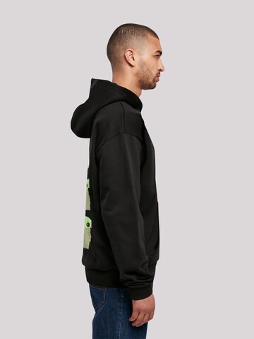 Sweat-shirt 'Star Wars The Mandalorian The Child Poses' F4NT4STIC en noir