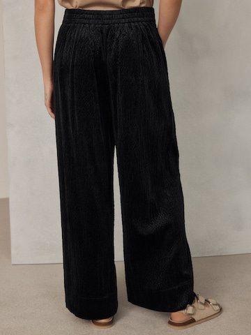 Wide leg Pantaloni di Next in nero