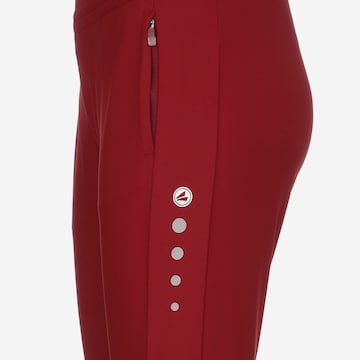 Skinny Pantalon de sport JAKO en rouge