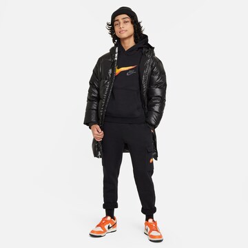 Nike Sportswear Tapered Housut värissä musta