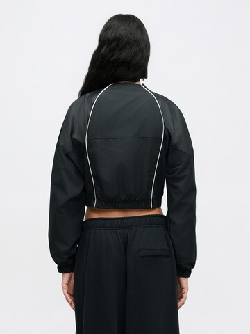 Veste mi-saison 'SHRUNKEN' Nike Sportswear en noir