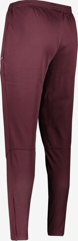 NIKE Regular Workout Pants in Red