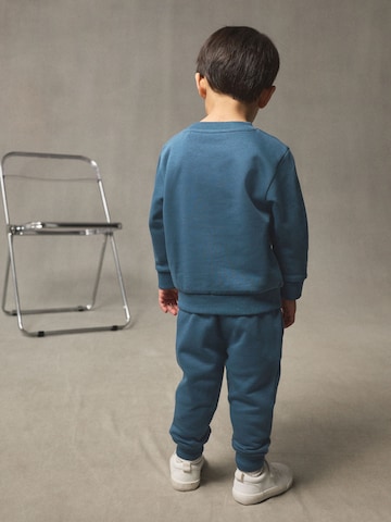 Set Next en bleu