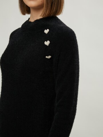 Influencer Sweter w kolorze czarny