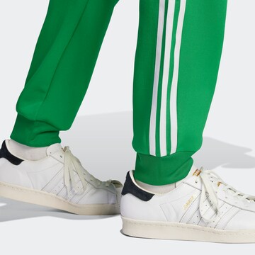 adidas sst green track pants