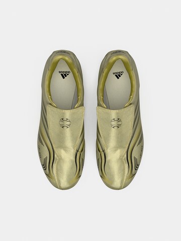 ADIDAS ORIGINALS Слипоны 'TAEKWONDO F50' в Золотой