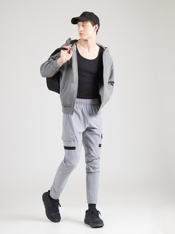 UNDER ARMOUR Ozke Športne hlače 'Tech Utility' | srebrna barva