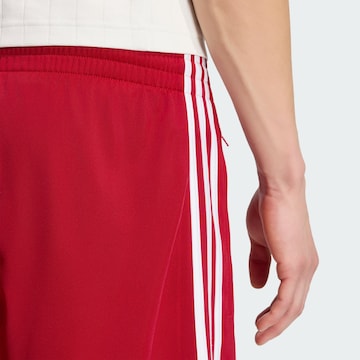 ADIDAS ORIGINALSregular Hlače 'Firebird' - crvena boja