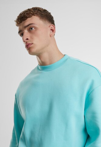 Sweat-shirt Urban Classics en bleu