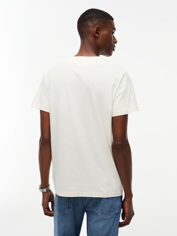 Tricou 'NYC' de la Tommy Jeans pe bej