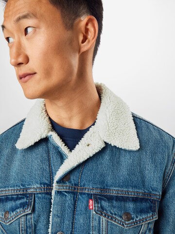 LEVI'S ® Between-Season Jacket 'Type 3 Sherpa Trucker' in Blue