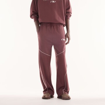 Pantaloni 'Trackside French Terry Pant' di new balance in rosso: frontale