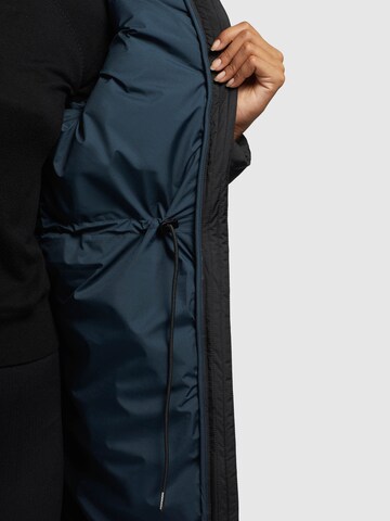 melns khujo Ziemas mētelis