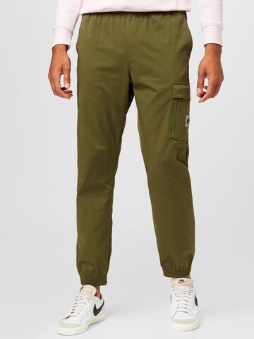 Nike Sportswear Tapered Trousers in Green: front