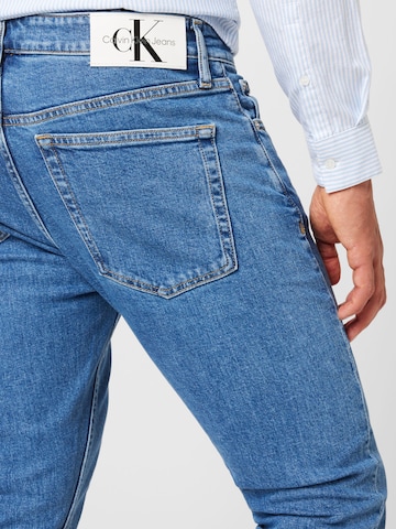 Calvin Klein Jeans نحيف جينز بلون أزرق