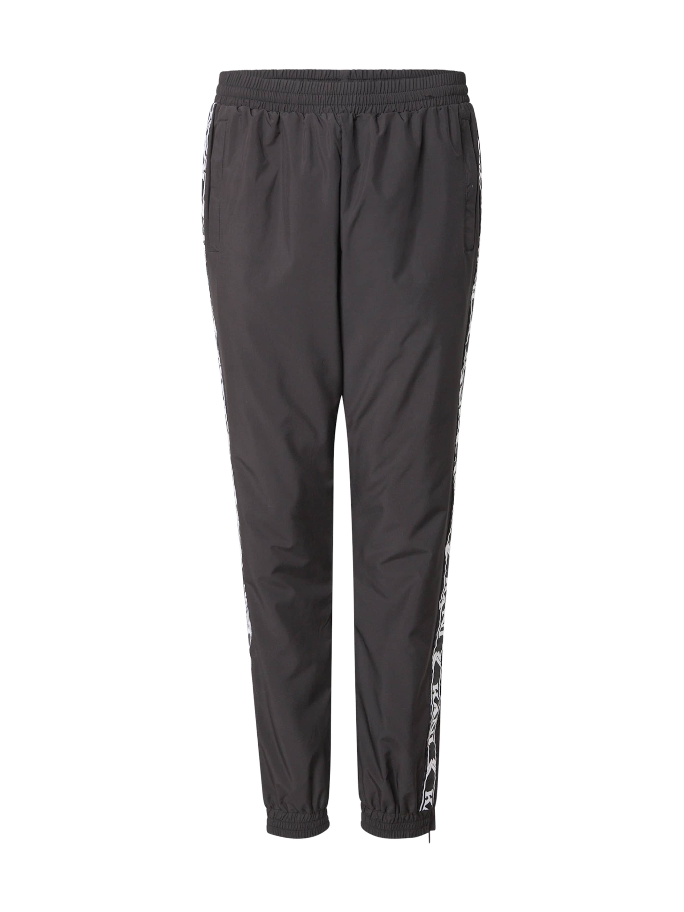 Karl Kani Tapered Trousers in Black: front