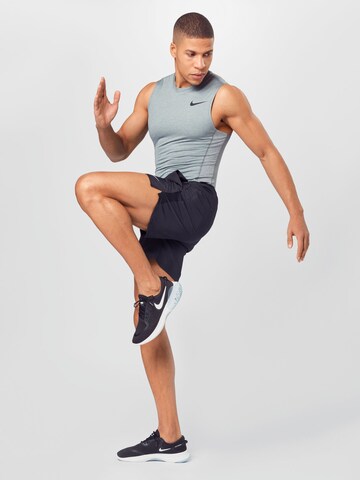 NIKE Regular Спортен панталон 'Challenger' в черно