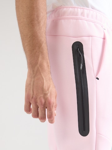 Nike Sportswear - Tapered Pantalón 'TCH FLC' en rosa