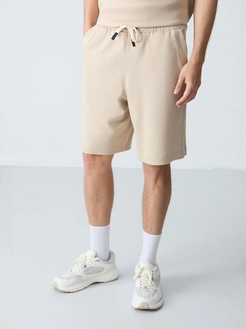 Tuta da jogging di Tommy Life in beige