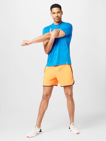UNDER ARMOUR Regularen Športne hlače | oranžna barva