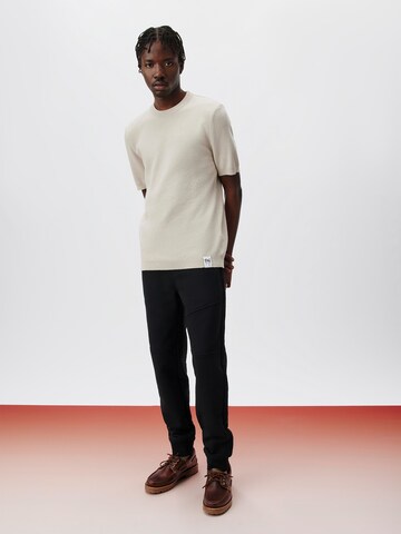 ABOUT YOU x Kingsley Coman Tapered Broek 'Lio' in Zwart