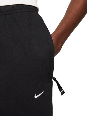 NIKE Regular Workout Pants 'Solo Swoosh' in Black