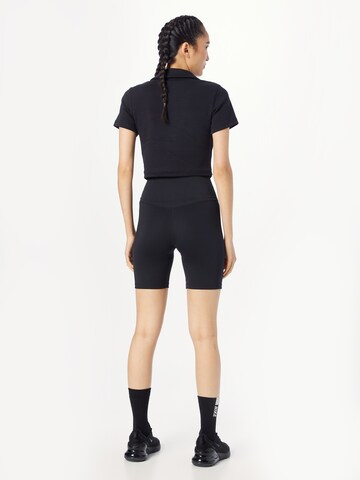 Skinny Pantaloni sportivi 'ONE' di NIKE in nero