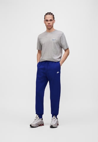 Nike Sportswear Tapered Housut 'CLUB' värissä sininen