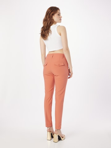regular Pantaloni con piega frontale di Summum in arancione