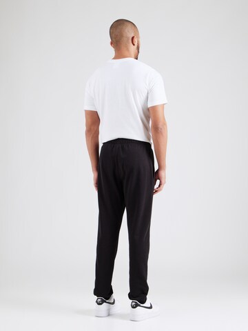 Champion Authentic Athletic Apparel - Tapered Pantalón en negro