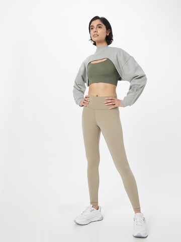 Skinny Pantaloni sportivi 'Gaby' di Athlecia in grigio