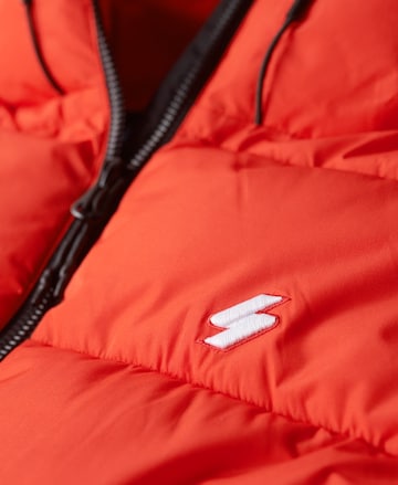 Superdry Zimní bunda – oranžová