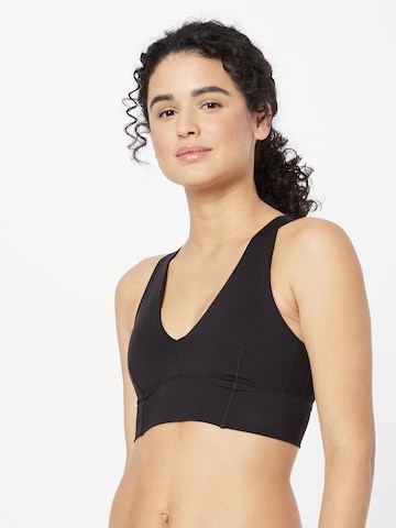 aim'n Bralette Sports Bra in Black: front